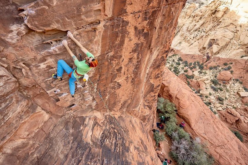 Climber scaling a rock face